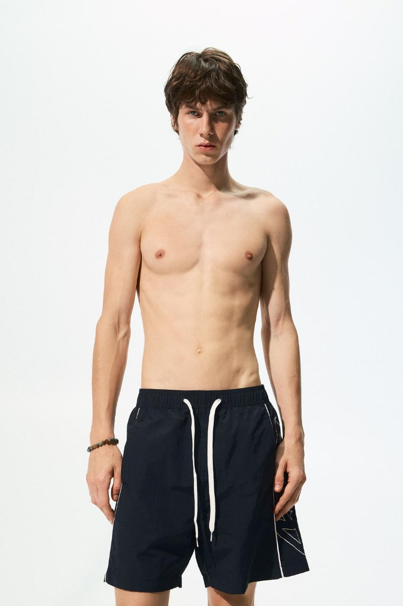 STWD side stripe swim shorts